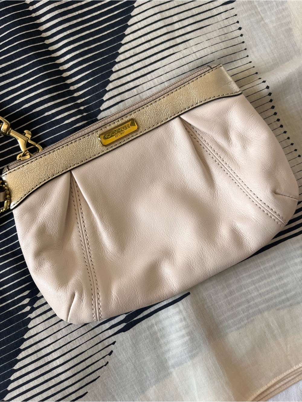 Coach peachy cream gold leather wristlet